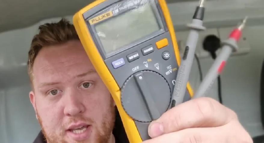 Electrician in Bath and West Wiltshire showing a multimeter used for testing when installing new lights
