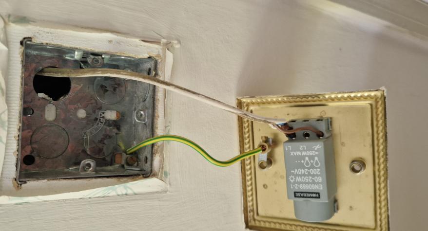 A lighting circuit with no earth and a metal switch.